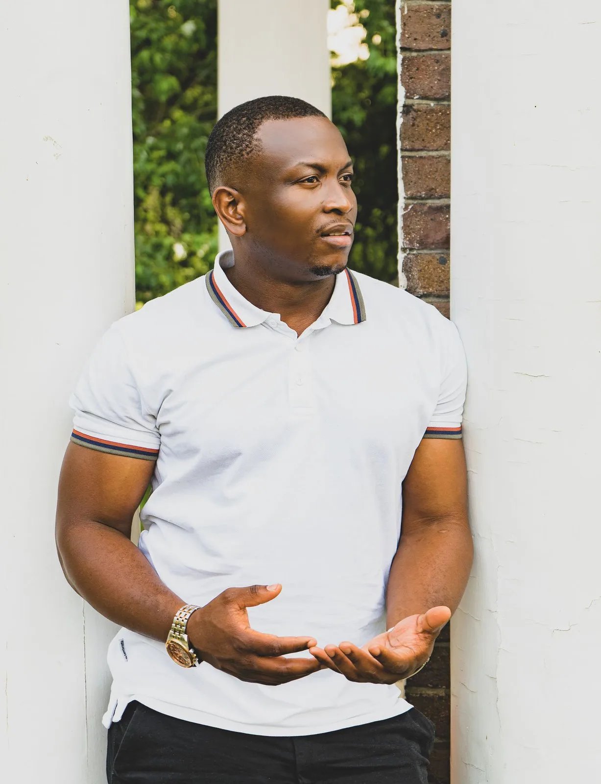 Man wearing a white pique polo shirt