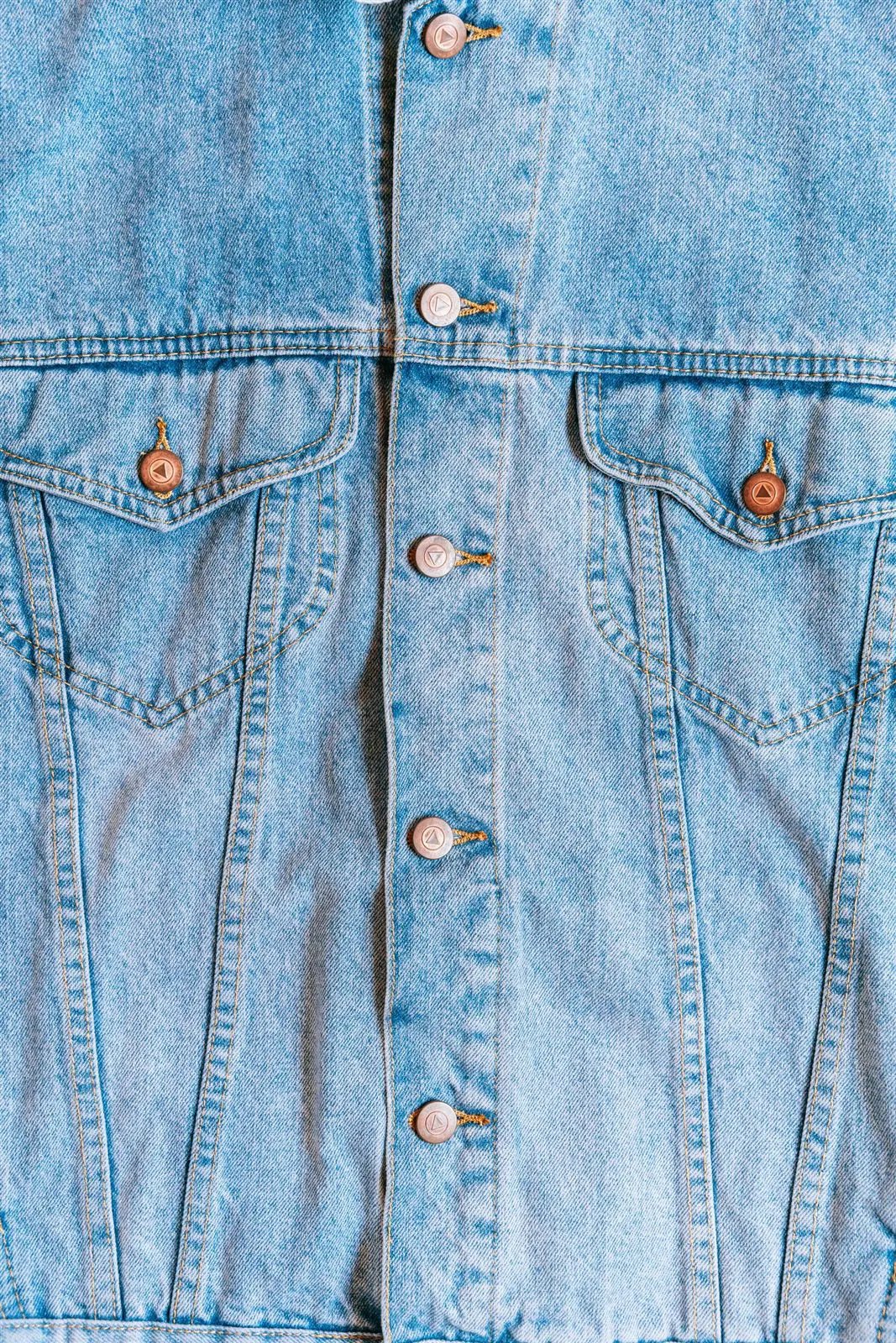 Person wearing a blue denim jacket